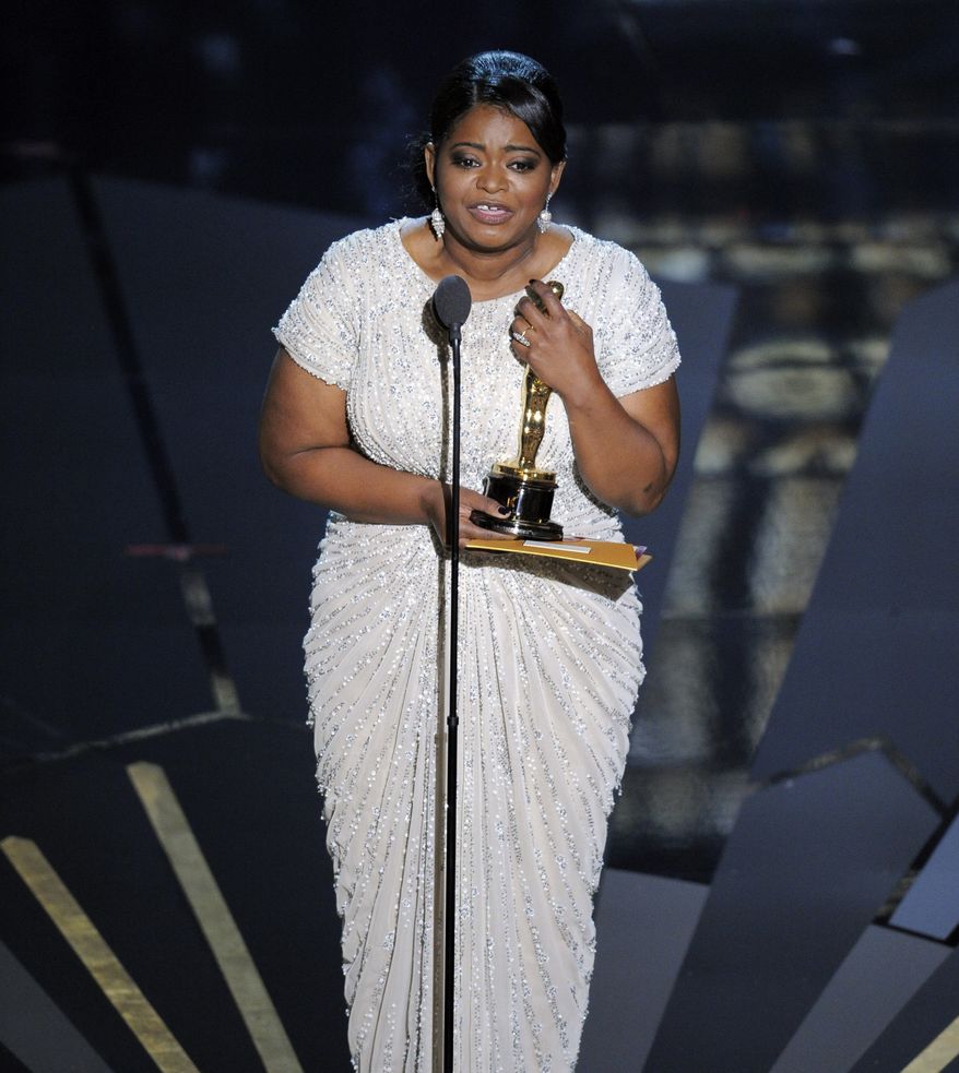 Octavia Spencer accepts the Oscar for best actress in a supporting role for "The Help" during the 84th Academy Awards on Sunday, Feb. 26, 2012, in the Hollywood section of Los Angeles. (AP Photo/Mark J. Terrill)