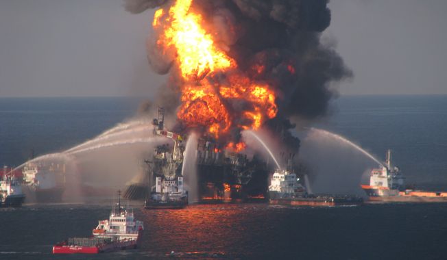 ** FILE ** Fire-boat response crews spray water on the burning remnants of BP&#x27;s Deepwater Horizon offshore oil rig on April 21, 2010. (AP Photo/U.S. Coast Guard)