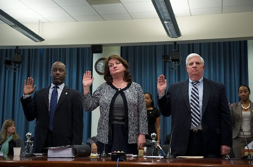 Officials of the Children and Youth Investment Trust Corp. being sworn in Monday before a D.C. Council committee are (from the left) Vice President Ed Davies, President and CEO Ellen London and Comptroller Michael O'Hearn. Former council member Harry Thomas Jr. used the nonprofit as a conduit to steal city funds. (Barbara L. Salisbury/The Washington Times)