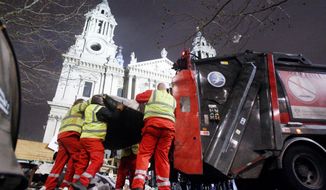 Police move in to clear out the Occupy London camp at St. Paul&#x27;s Cathedral on Tuesday. Britain&#x27;s High Court last Wednesday rejected the protesters&#x27; legal challenge to an eviction order. Local authorities claimed the camp had harmed nearby businesses, caused waste and hygiene problems, and attracted crime and disorder. (Associated Press)