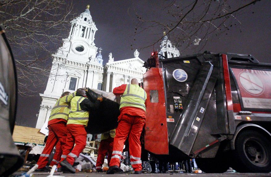 Police move in to clear out the Occupy London camp at St. Paul's Cathedral on Tuesday. Britain's High Court last Wednesday rejected the protesters' legal challenge to an eviction order. Local authorities claimed the camp had harmed nearby businesses, caused waste and hygiene problems, and attracted crime and disorder. (Associated Press)