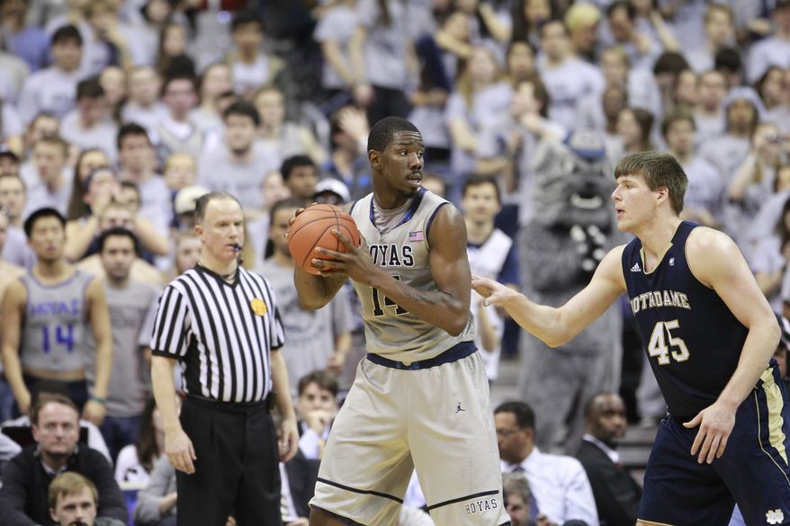 Notre Dame's Jack Cooley guards Georgetown's Henry Sims during the second half Monday, Feb. 27, 2012, in Washington. Georgetown won 59-41. (AP Photo/Haraz N. Ghanbari)