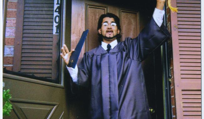 **FILE** In this 1999 file family photo provided by the Center for Constitutional Rights, Majid Khan gestures during his senior year of high school in Baltimore. The former Maryland resident is accused of joining al Qaeda and plotting to blow up fuel tanks in the U.S. (Associated Press/The Khan Family, Center for Constitutional Rights)