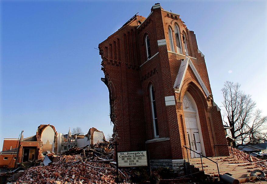 St. Joseph's Catholic Church is seen left in ruins Thursday, March 1, 2012, in Ridgway, Ill. A pre-dawn twister flattened entire blocks of homes Wednesday as violent storms ravaged the Midwest and South. (AP Photo/Seth Perlman)