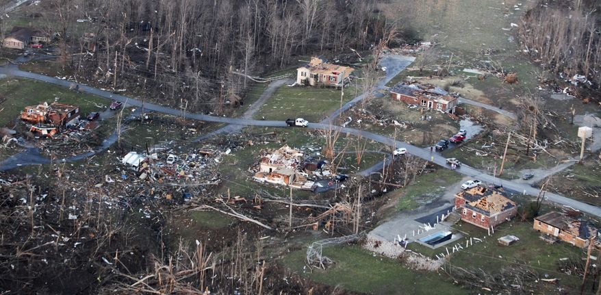 Piles of splintered wood is all that remains of homes in Henryville, Ind., Friday, March 2, 2012, in Marysville, Ind. Powerful storms stretching from the Gulf Coast to the Great Lakes flattened buildings in several states, wrecked two Indiana towns and bred anxiety across a wide swath of the country in the second powerful tornado outbreak this week. (AP Photo/The Courier-Journal, Michael Clevenger)
