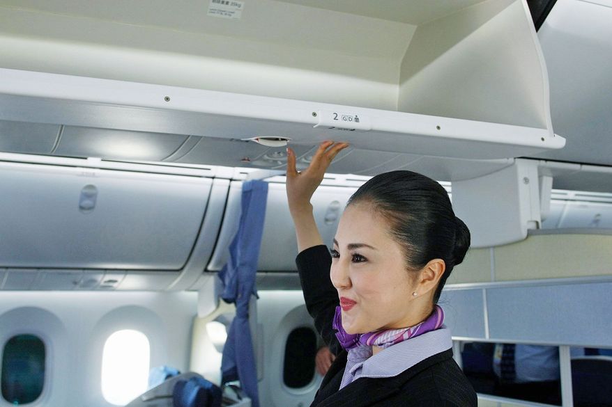 United and Delta have become the latest airlines to replace or upgrade overhead bins so they hold more luggage. The percentage of passengers bringing bags on planes has hovered around 87 percent in recent years. (Associated Press)