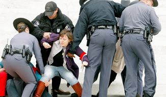 Virginia Capitol Police arrest more than 30 pro-choice activists when they refused to disperse as ordered. (Associated Press)