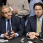 **FILE** New York Mets owner Fred Wilpon (left) and COO Jeff Wilpon listen to a question from the media during a Oct. 29, 2010, baseball news conference in New York. (Associated Press)