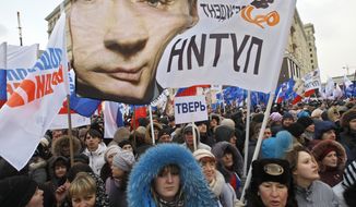 Supporters of Russian Prime Minister Vladimir Putin rally March 5, 2012, at the central Manezhnaya Square just outside the Kremlin in Moscow to celebrate Putin&#x27;s victory in the presidential election. (Associated Press)