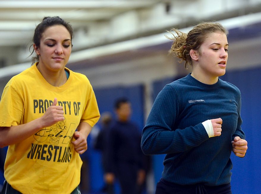 Helen Maroulis, a wrestler from Rockville, Md, may be the best U.S. wrestler in her weight class. She is currently training at the U.S. Olympic Training Center in Colorado Springs, Colo. She and other members of the U.S. team, as well as wrestlers from other countries, spent time training together, Thursday, Mar. 1, 2012. Maroulis takes a jog around the gym. The wrestlers were having light workouts in preparation for a trip to China.(BryanOller/Special to the Washington Times)