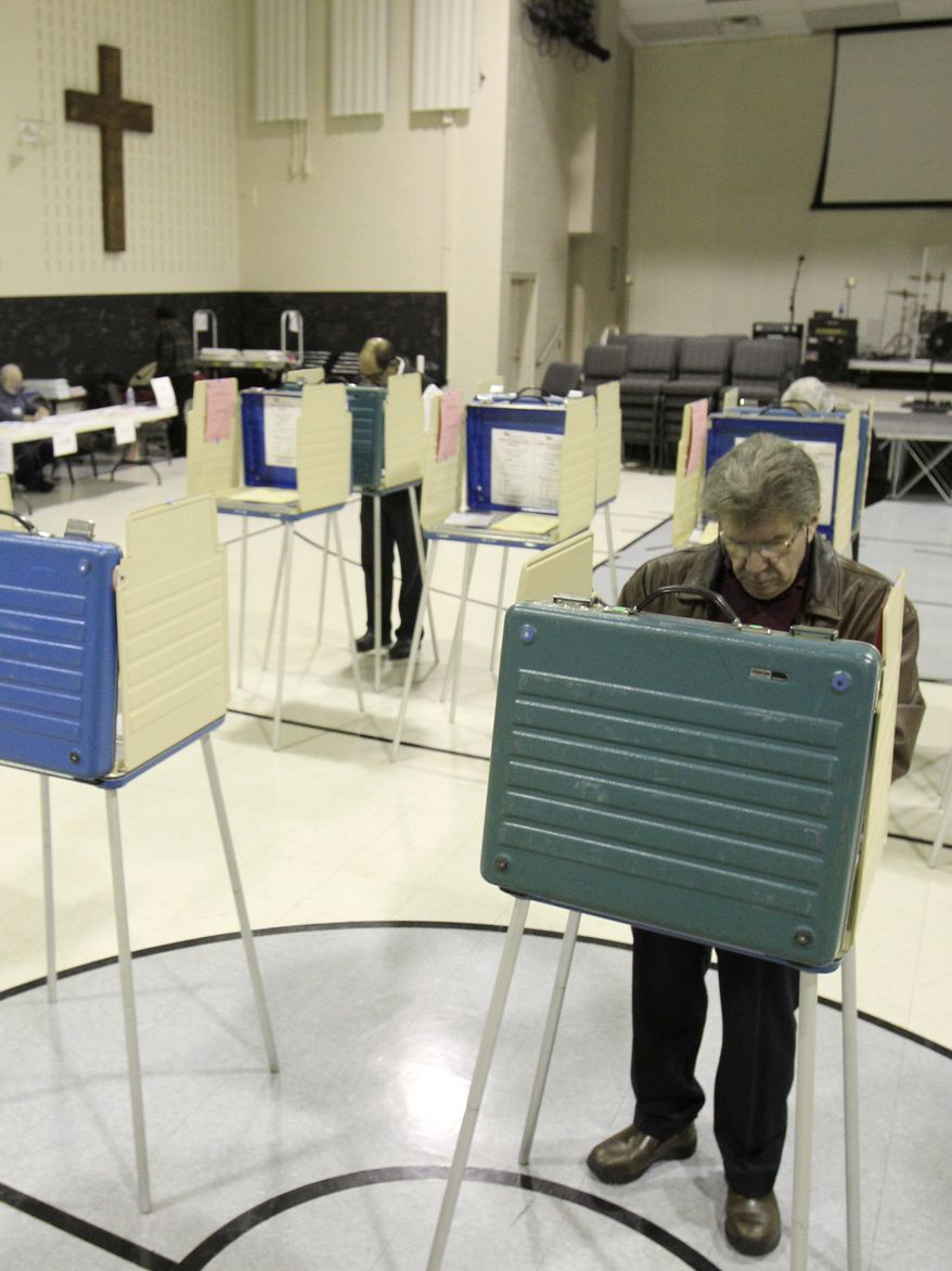 Carl LoPresti votes March 6, 2012, in the Republican presidential primary election at Garfield Memorlal Church in Pepper Pike, Ohio. (Associated Press)