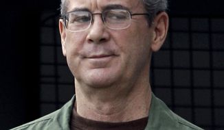 ** FILE ** Jailed Texas tycoon R. Allen Stanford arrives in custody at the federal courthouse in Houston in August 2010. (AP Photo/David J. Phillip)