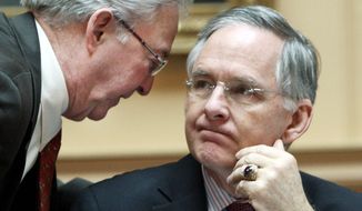 Sen. Walter A. Stosch (left), chairman of the Senate Finance Committee, confers with Senate Majority Leader Thomas K. Norment Jr. during Wednesday&#39;s floor session. With adjournment set for Saturday, there is no agreement on a budget. (Associated Press)