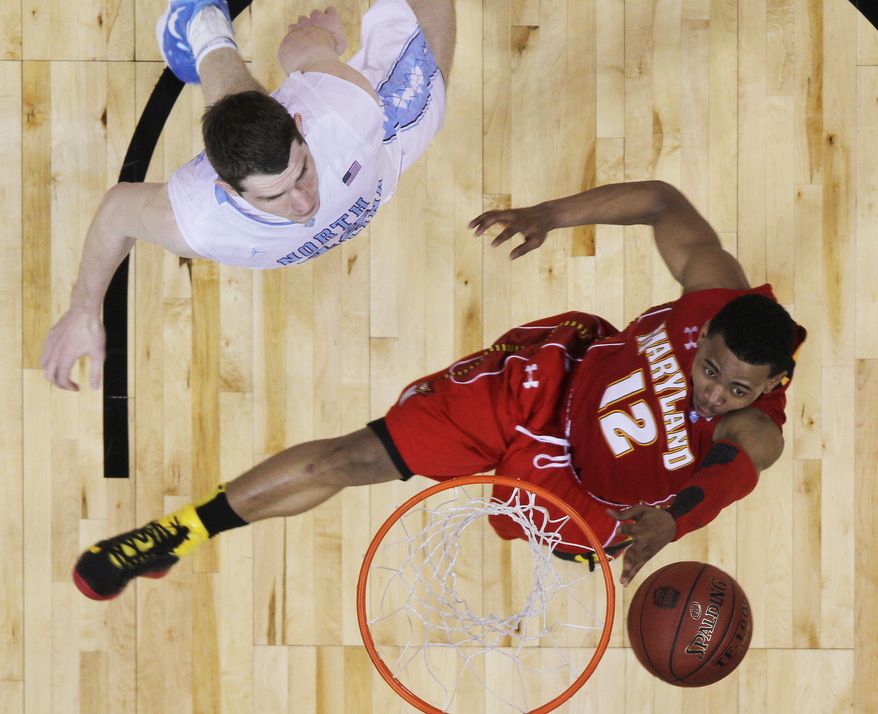 Maryland guard Terrell Stoglin shoots as North Carolina forward Tyler Zeller defends during the second half of the ACC tournament quarterfinals, Friday, March 9, 2012, in Atlanta. North Carolina won 85-69. (AP Photo/John Bazemore)