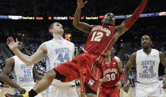 Maryland guard Terrell Stoglin shoots as North Carolina forward Tyler Zeller looks on during the second half in the quarterfinals of the ACC tournament, Friday, March 9, 2012, in Atlanta. North Carolina won 85-69. (AP Photo/Chuck Burton)