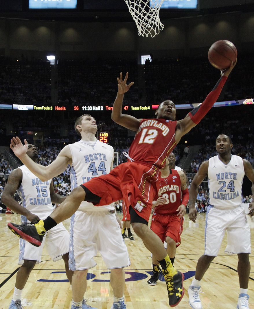 Maryland guard Terrell Stoglin shoots as North Carolina forward Tyler Zeller looks on during the second half in the quarterfinals of the ACC tournament, Friday, March 9, 2012, in Atlanta. North Carolina won 85-69. (AP Photo/Chuck Burton)