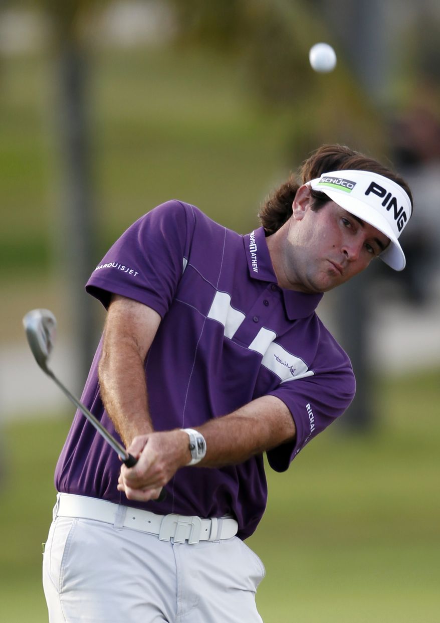 Bubba Watson chips onto the 18th hole green during the third round of the Cadillac Championship tournament on Saturday, March 10, 2012 in Doral, Fla. (AP Photo/Wilfredo Lee)