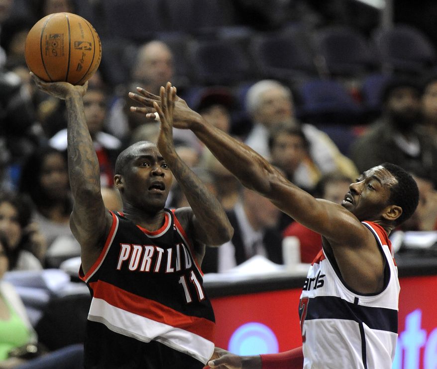 Portland Trail Blazers' Jamal Crawford goes up for the shot against the defense of Washington Wizards' John Wall during second half on Saturday, March 10, 2012, in Washington. Portland defeated Washington 110-99. (AP Photo/Richard Lipski)