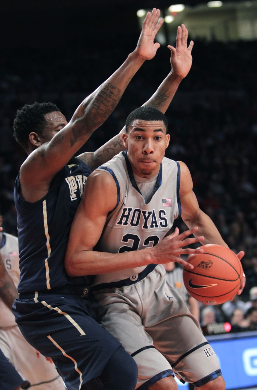 Georgetown's Otto Porter pushes past Pittsburgh's Nasir Robinson during the second round of the Big East tournament in New York, Wednesday, March 7, 2012. (AP Photo/Seth Wenig)