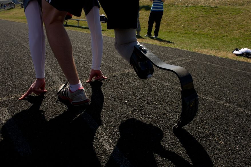 Spc. Brynden Keller of Indianapolis, Ind. who lost his leg outside of Kandahar Providence in Afghanistan gets ready to start a sprint with other wounded soldiers and Army veterans from across the United States in the Army Warrior Games clinics for a chance at a spot on the Army Warrior Games team, Fort Meade, Md., Sunday, March 11, 2012. The 2012 Warrior Games, held April 30th - May 5th in Colorado Springs, Colo., features representatives from Army, Navy, Air Force, Marines and Special Operations and will compete for gold metals in archery, cycling, wheelchair basketball, shooting, swimming, track and field, and sitting volleyball. (Andrew Harnik/The Washington Times)