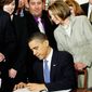 House Speaker Nancy Pelosi was one of the dignitaries on hand as President Obama signed the Affordable Care Act on March 23, 2010. The Supreme Court will start hearing arguments on the law&#39;s insurance mandate on March 26. (Associated Press)
