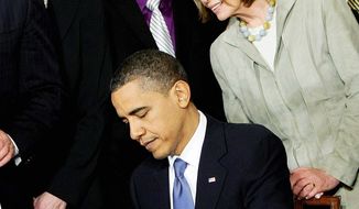 House Speaker Nancy Pelosi was one of the dignitaries on hand as President Obama signed the Affordable Care Act on March 23, 2010. The Supreme Court will start hearing arguments on the law&#39;s insurance mandate on March 26. (Associated Press)