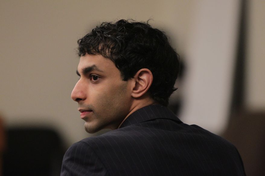 Dharun Ravi listens to testimony March 12, 2012, during his trial at the Middlesex County Courthouse in New Brunswick, N.J. Ravi, 20, is accused of using a webcam to spy on his roommate's intimate encounter with another man. His roommate, Tyler Clementi, committed suicide in September 2010, just days after the alleged spying. (Associated Press/The Star-Ledger)