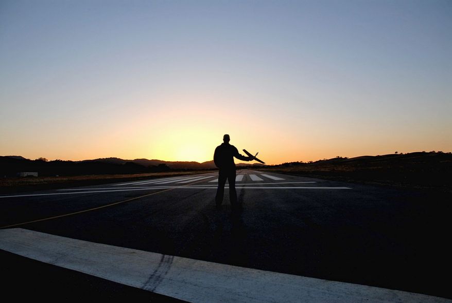 The hand-held Wasp drone needs no runway. Drones can be the size of jetliners or Frisbees. (Aerovironment Inc.)