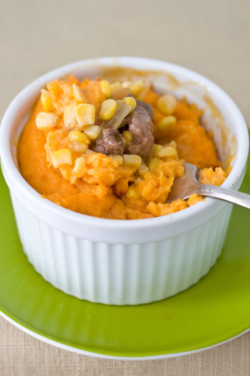 Shepherd's pie gets a new look and taste when made with ground sausage and beef, with a layer of corn and a sweet-potato topping. (Associated Press)