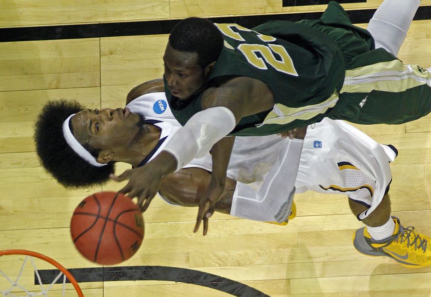 associated press
Murray State's Edward Daniel takes a charge from Will Bell in the Racers' 58-41 victory over Colorado State on Thursday.
