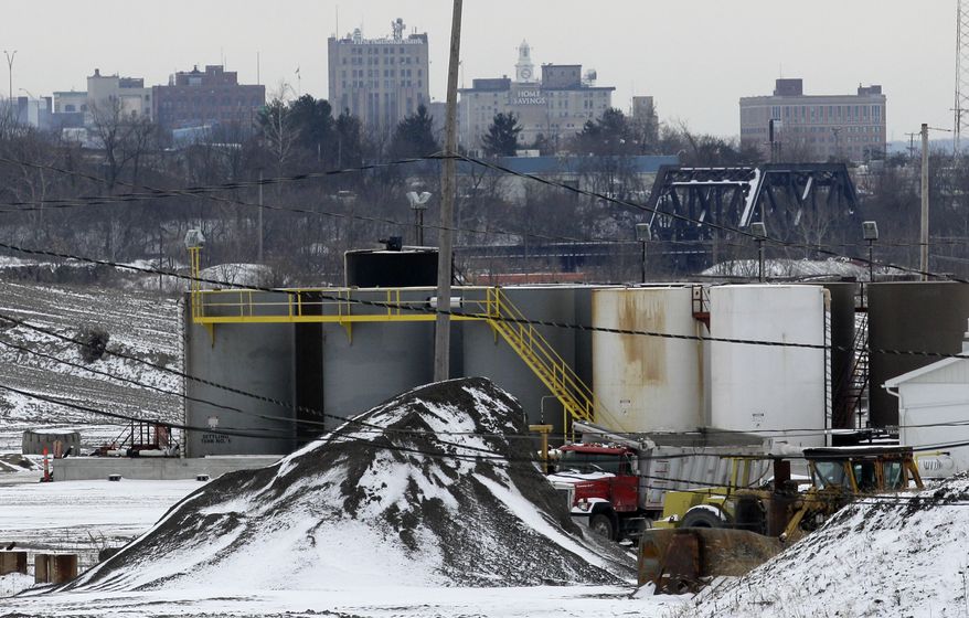 **FILE** A brine injection well owned by Northstar Disposal Services LLC is seen Jan. 4, 2011, in Youngstown, Ohio, with the skyline of Youngstown in the distance. (Associated Press)