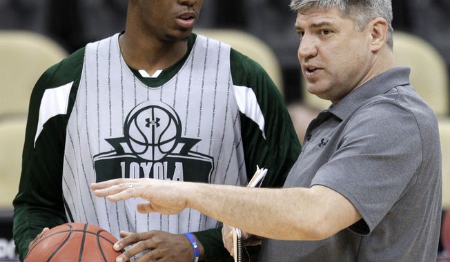 Loyola coach Jim Patsos, right, talks with Jordan Latham during practice in Pittsburgh, Wednesday, March 14, 2012. Loyola plays Ohio State in an NCAA men&#x27;s college basketball tournament second-round game Thursday. (AP Photo/Gene J. Puskar)