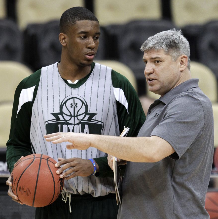 Loyola coach Jim Patsos, right, talks with Jordan Latham during practice in Pittsburgh, Wednesday, March 14, 2012. Loyola plays Ohio State in an NCAA men's college basketball tournament second-round game Thursday. (AP Photo/Gene J. Puskar)