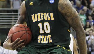 Norfolk State&#x27;s Kyle O&#x27;Quinn celebrates after defeating Missouri 86-84 in the Round of 64 of the NCAA tournament at CenturyLink Center in Omaha, Neb., Friday, March 16, 2012. (AP Photo/Nati Harnik)