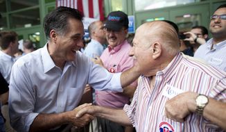 ** FILE ** Republican presidential candidate, former Massachusetts Gov. Mitt Romney shakes hands during a campaign stop on Saturday, March 17, 2012, in Bayamon, Puerto Rico. (AP Photo/Evan Vucci)