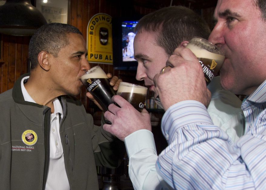 ** File ** President Obama drinks a Guinness at the Dubliner Restaurant and Pub on St. Patrick's Day, March 17, 2012, in Washington. (Associated Press)