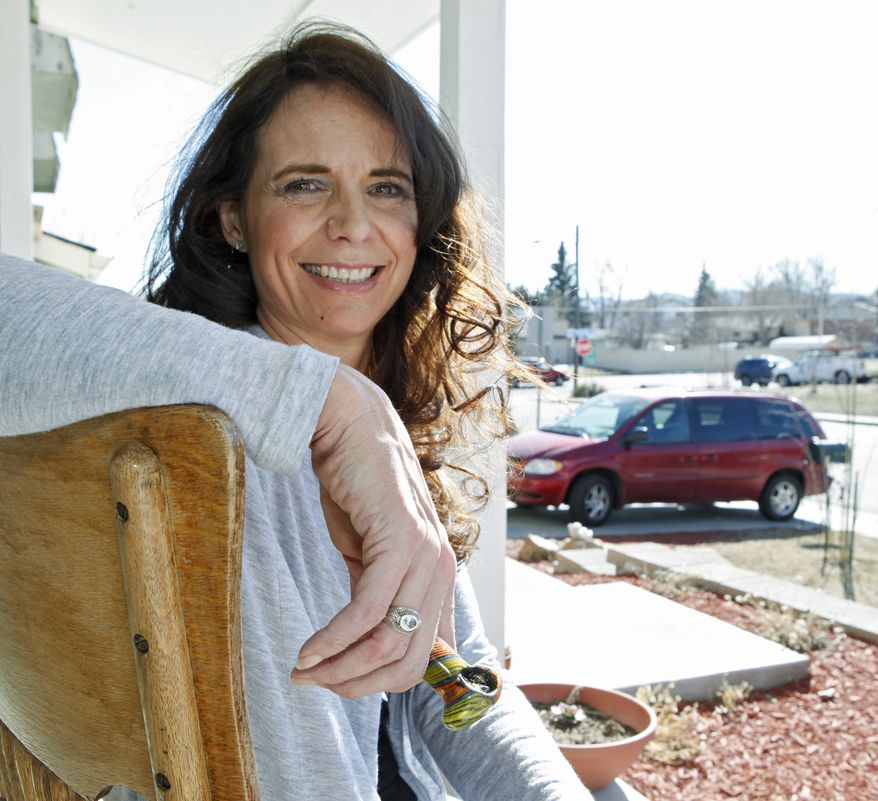 Angeline Chilton of suburban Denver smokes marijuana twice a day to ease tremors from multiple sclerosis. Ms. Chilton insists that she never drives high, but she fears that officials will rush to set an unproven blood-level standard that would put her at risk of breaking the law. (AP Photo/Ed Andrieski)