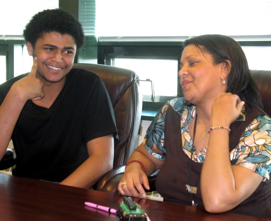 Alton Burke (left), 17, a senior at South Hagerstown High School in Hagerstown, Md., talks with student intervention specialist Heather Dixon on Wednesday, March 14, 2012. (AP Photo/Kimberly Hefling)