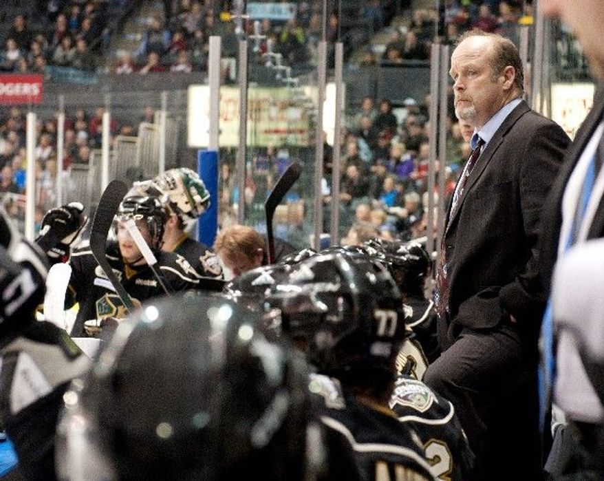 Mark Hunter has called the shots on the bench for the Ontario Hockey League's London Knights since his brother, Dale, was hired to coach the Capitals on Nov. 28. The Knights have gone 29-13 in Dale Hunter's absence. (Craig Glover/Special to The Washington Times)