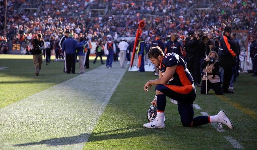 ** FILE ** In this Dec. 11, 2011 file photo, Denver Broncos quarterback Tim Tebow prays in the end zone before the start of an NFL game against the Chicago Bears, in Denver. Peyton Manning has joined the Broncos. The addition of Manning could well lead to Denver trading Tebow, even though the popular QB energized the Broncos in leading them to the playoffs last season despite some uneven play. (AP Photo/Julie Jacobson, File)