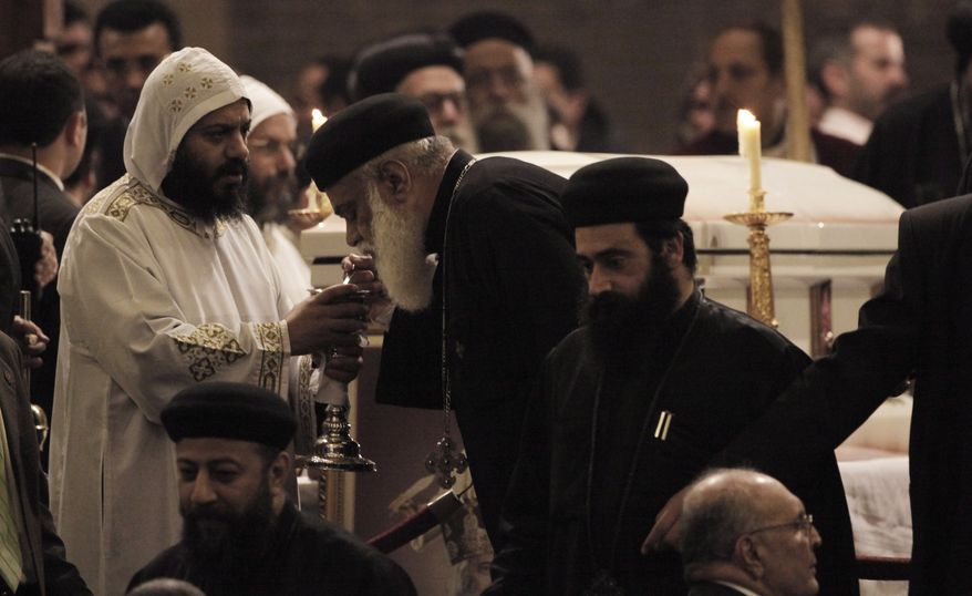 Senior clerics gather to pay their final respects during the funeral Mass of Pope Shenouda III at the Coptic Orthodox cathedral in Cairo on Tuesday, March 20, 2012. (AP Photo/Nasser Nasser)