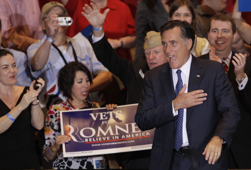 Republican presidential candidate Mitt Romney leaves at an election-night event in Schaumburg, Ill., on Tuesday, March 20, 2012, after winning the Illinois primary. (AP Photo/Nam Y. Huh)