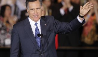 Republican presidential candidate, former Massachusetts Gov. Mitt Romney waves as he speaks at an election night event in Schaumburg, Ill., Tuesday, March 20, 2012. Romney won the Illinois Primary. (AP Photo/Nam Y. Huh)