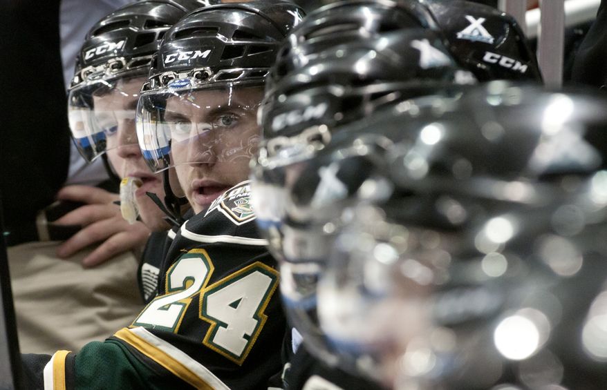 London Knights captain Jarred Tinordi watches his teammates play while resting on the team bench during their junior hockey game against the Oshawa Generals at the John Labatt Centre in London, Ontario, Canada on Friday March 2, 2012. Tinordi's father, Mark, is a former player of the Washington Capitals. (Craig Glover/Special to The Washington Times)