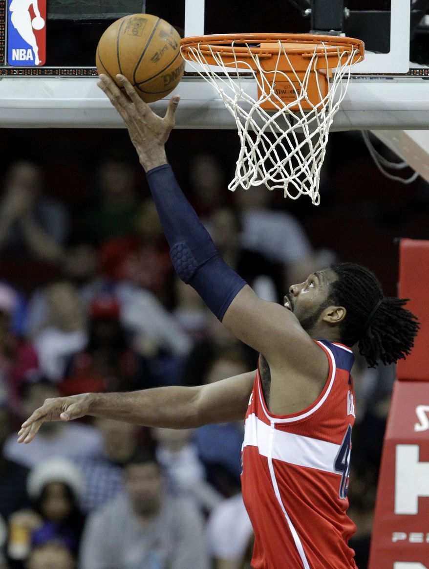Wizards center Nene averaged 13.7 points and 7.5 rebounds last season. (AP Photo/Julio Cortez)