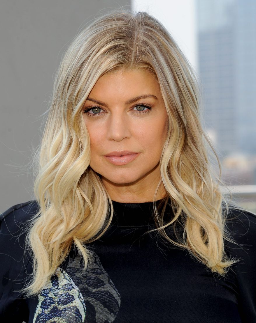 Singer Stacy "Fergie" Ferguson announces her partnership in Voli Light Vodkas at the James Hotel on Thursday, March 22, 2012 in New York. (AP Photo/Evan Agostini)