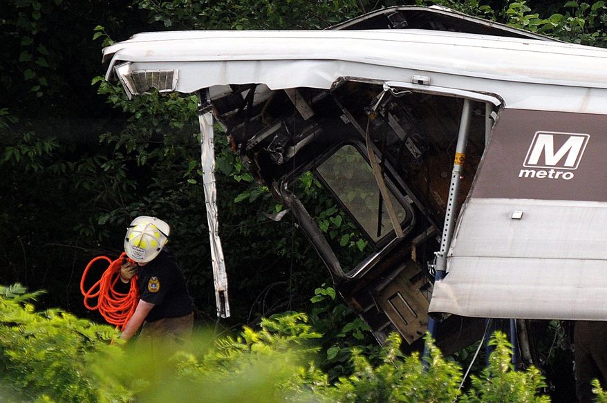 Rescue workers arrive at the crash site where two Metro trains collided head-on near the Fort Totten Metro Station in June 2009. "When the accident happened in 2009, I called a supervisor and said, 'Is this the one we all dreaded?' " said Christine Townsend, who sued Metro for discrimination and won. (The Washington Times)