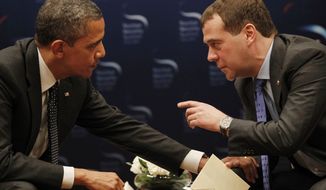 ** FILE ** Unaware that a microphone was recording him, President Obama asked outgoing Russian President Dmitry Medvedev on Monday, March 26, 2012, for breathing room until after Mr. Obama&#39;s re-election campaign to negotiate on missile defense. (AP Photo/Pablo Martinez Monsivais)