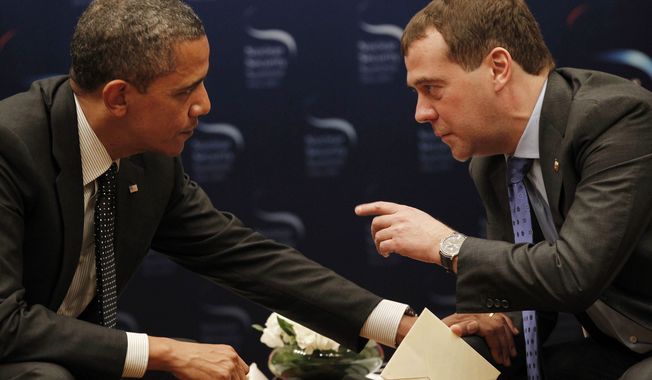 ** FILE ** Unaware that a microphone was recording him, President Obama asked outgoing Russian President Dmitry Medvedev on Monday, March 26, 2012, for breathing room until after Mr. Obama&#x27;s re-election campaign to negotiate on missile defense. (AP Photo/Pablo Martinez Monsivais)