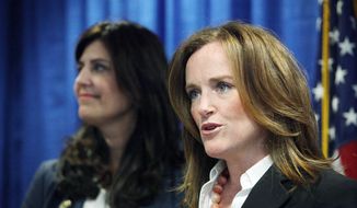 Nassau County District Attorney Kathleen Rice (right) joins Kathryn Juric, vice president of the SAT program for the College Board, in Mineola, N.Y., on Tuesday as they announce a security overhaul to prevent cheating on the SAT exams.